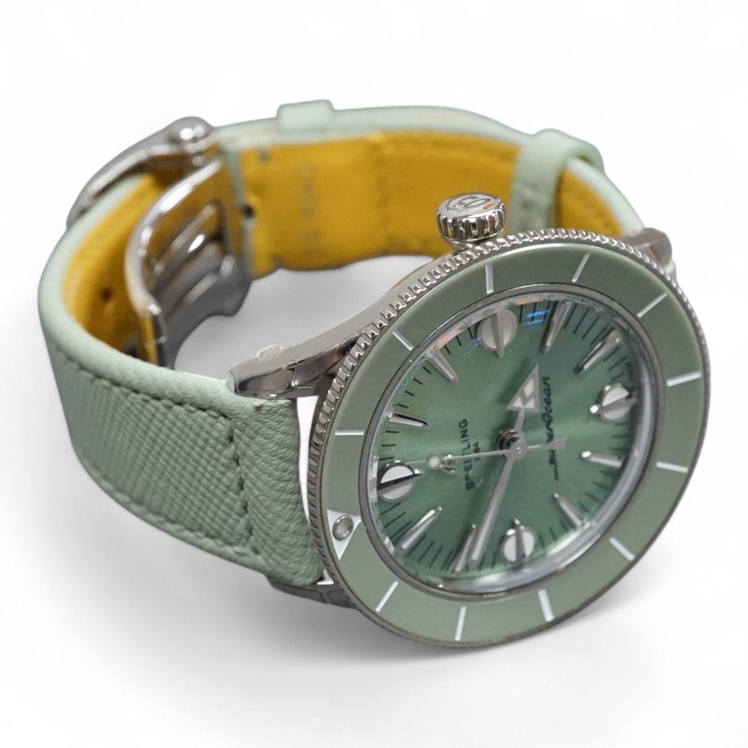 A lady's recent stainless steel Breitling SuperOcean Heritage Automatic cal. 38 57 chronometer wrist watch, with light green dial and baton numerals, case diameter 37mm, on a light green leather strap with Breitling buck